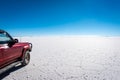 A 4Ãâ4 travels across a vast salt lake Royalty Free Stock Photo